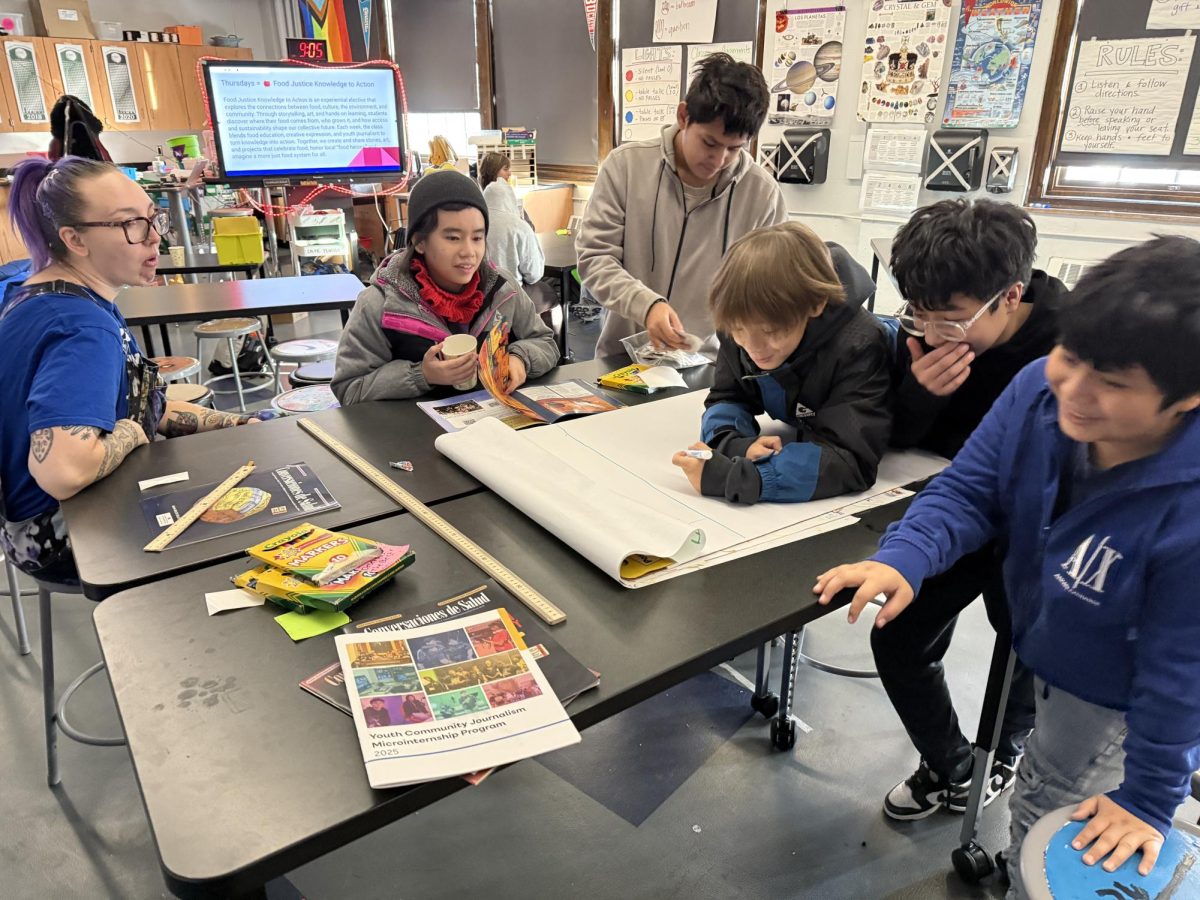 Middle school students at Ella Baker Global Studies and Humanities Magnet School in Minneapolis work on a community newspaper for Food Justice Knowledge to Action, an innovative program that blended science, art, gardening, and youth journalism. (Eric Ortiz)

